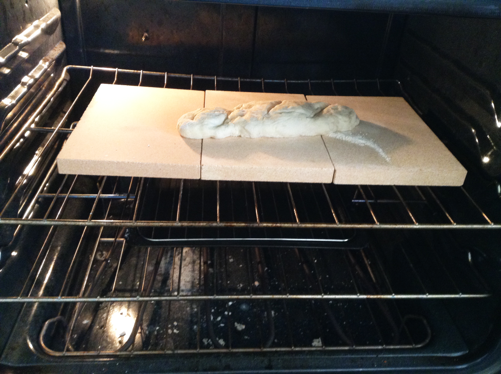 French Bread Baguette on baking stone fresh in oven