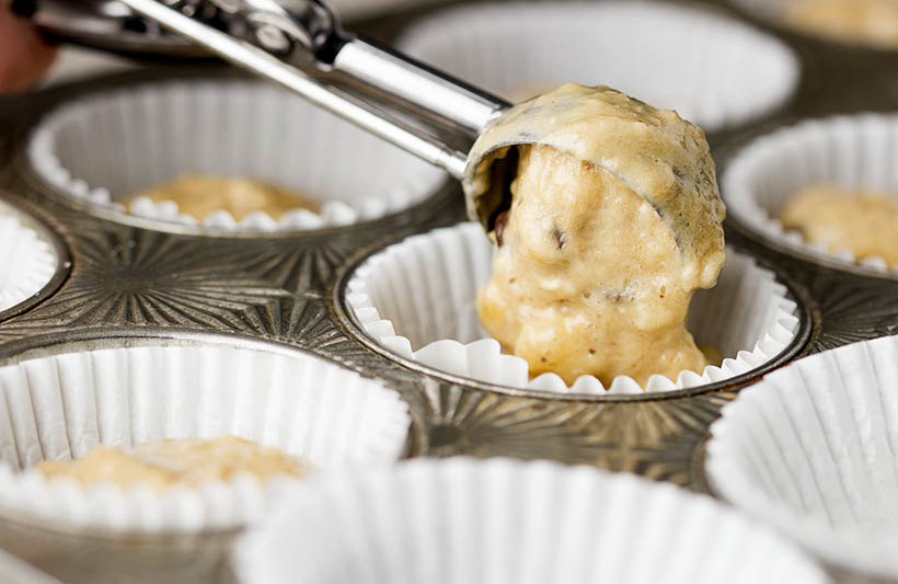 chocolate-chip-banana-muffins-scooping-batter