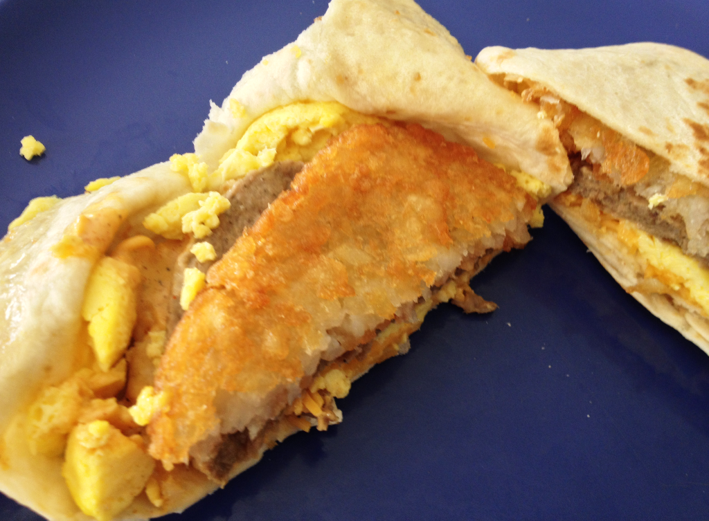 Taco Bell Breakfast A.M. Crunchwrap with sausage inside close up