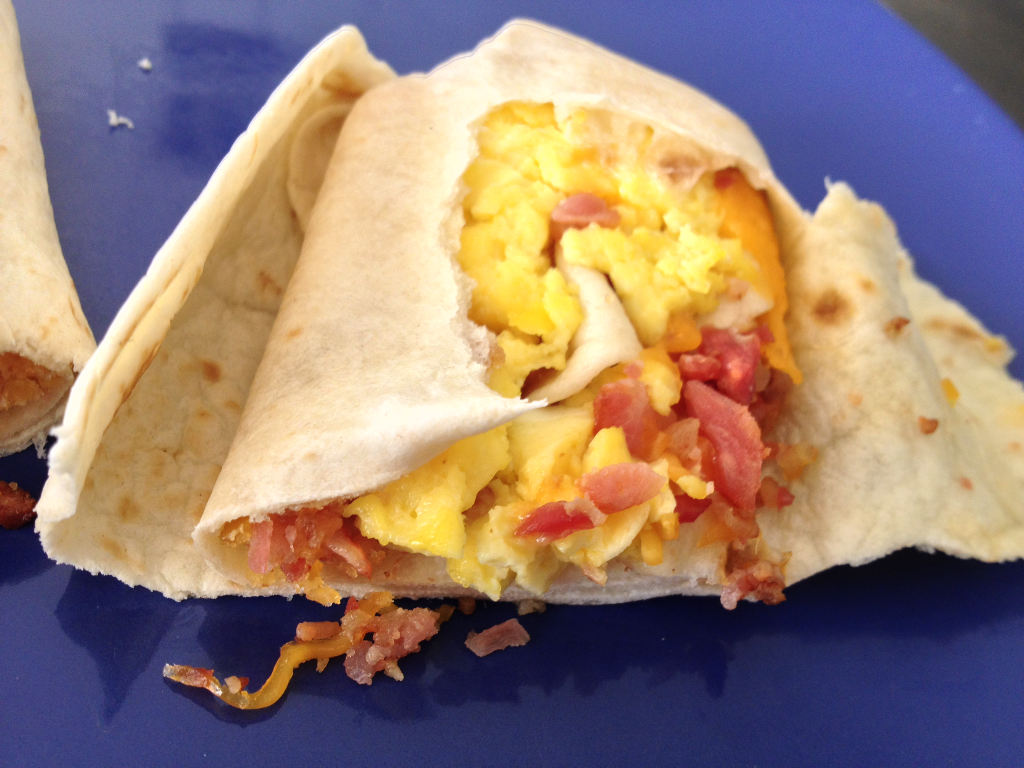 Taco Bell Breakfast Breakfast Burrito with Bacon inside close up
