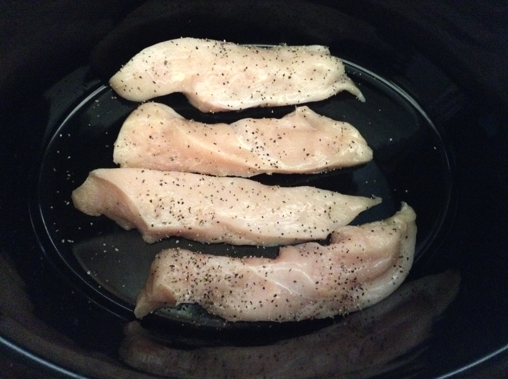 Crock Pot Fajitas chicken salted and peppered in crock pot