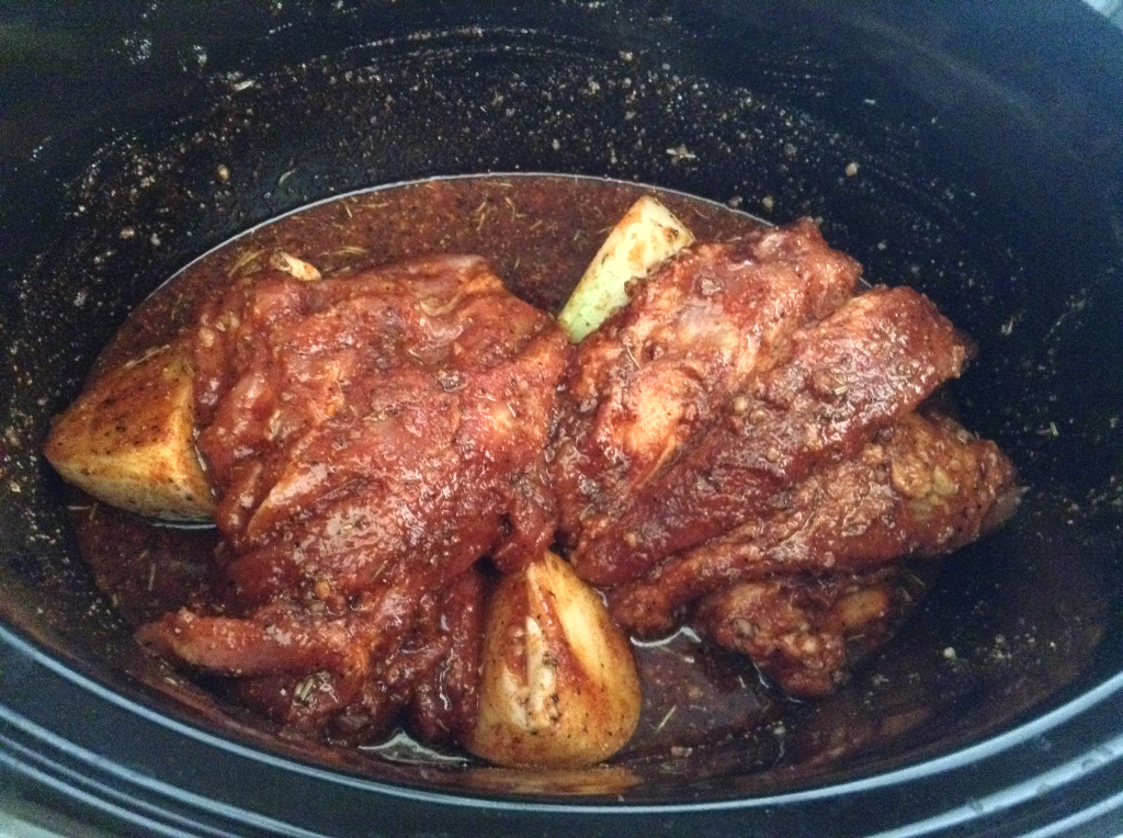 Crock Pot Pulled Pork covered with spice paste