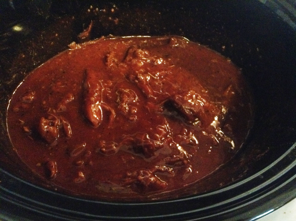 Crock Pot Pulled Pork with bbq sauce added before cooking