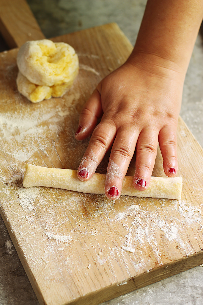 adding eggs into gnocchi